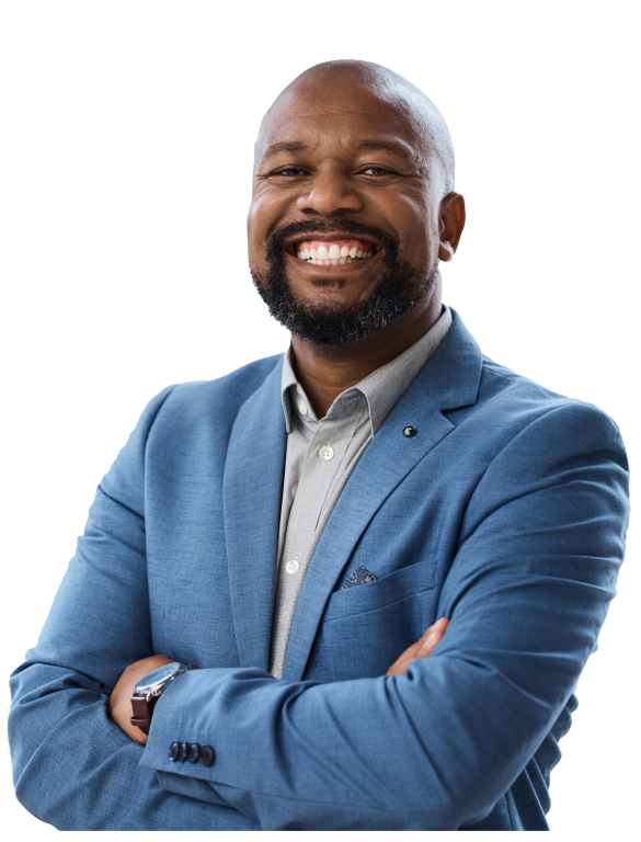 Hero-Intro-Agile-Coaching A businessman in a blue blazer smiles and poses with arms crossed across his chest